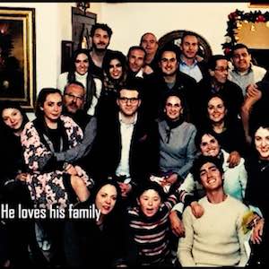 The narrator's brother is shown in a large picture with his family. The caption reads 