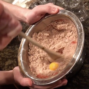 Eggs are mixed into the cookie batter
