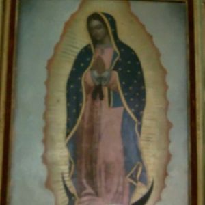 A framed image of Senora de Guadalupe