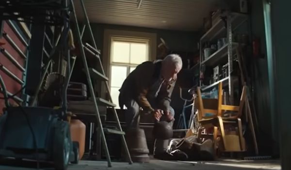 Older man lifting a kettlebell to build his strength