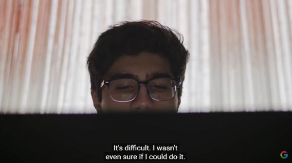 boy wearing glasses looking off camera