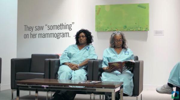 two women sitting in a hospital waiting room, one seems worried