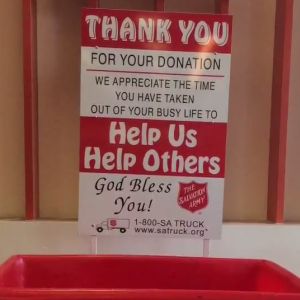 A sign above a donation box thanks people for their contributions